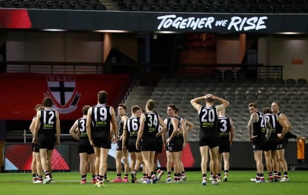 The Saints look dejected after a loss during the 2021 AFL Round 18 match between the St Kilda Saints and the Port Adelaide Power at Marvel Stadium on...