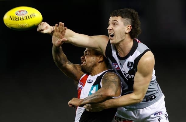 Bradley Hill of the Saints and Darcy Byrne-Jones of the Power in action during the 2021 AFL Round 18 match between the St Kilda Saints and the Port...