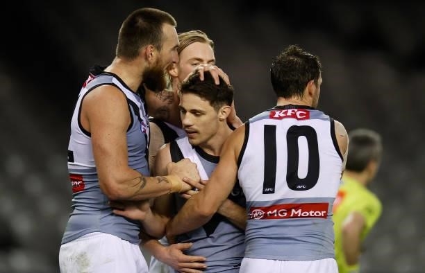 Charlie Dixon, Jed McEntee and Travis Boak of the Power celebrate during the 2021 AFL Round 18 match between the St Kilda Saints and the Port...