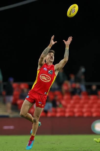 Alex Sexton of the Suns attempts a mark during the 2021 AFL Round 18 match between the Gold Coast Suns and the Western Bulldogs at Metricon Stadium...