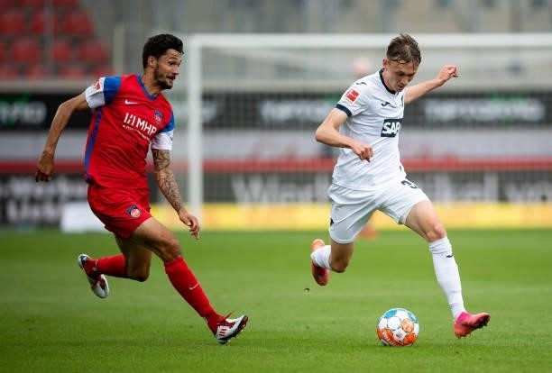Tim Kleindienst of Heidenheim in action with Maximilian Beier of Hoffenheim during the Bundesliga Pre-Season Match between 1. FC Heidenheim 1846 and...