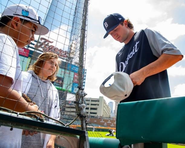 Casey Mize of the Detroit Tigers signs autographs for fans before game one of a doubleheader against the Minnesota Twins at Comerica Park on July 17,...