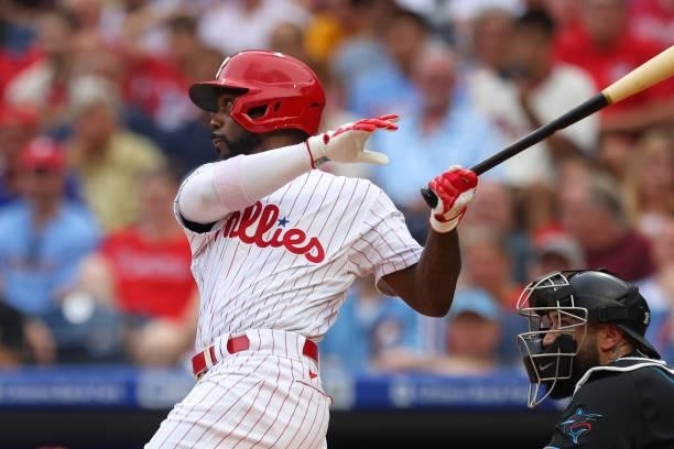 Andrew McCutchen of the Philadelphia Phillies hits an RBI sacrifice fly during the first inning of a game at Citizens Bank Park on July 17, 2021 in...