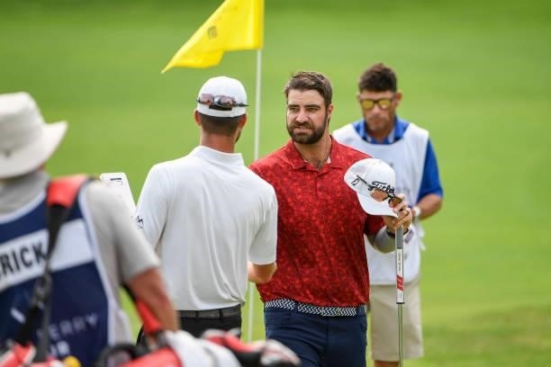Tom Whitney shakes hands with other players during the third round of the Memorial Health Championship presented by LRS at Panther Creek Country Club...