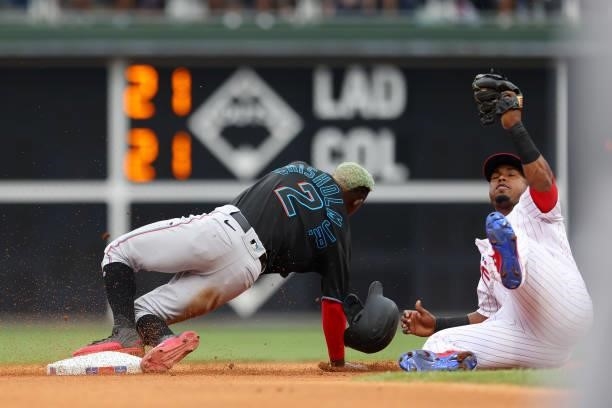 Jazz Chisholm Jr. #2 of the Miami Marlins is tagged out by second baseman Jean Segura of the Philadelphia Phillies attempting to steal second base...
