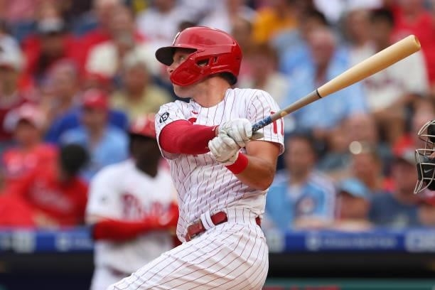 Rhys Hoskins of the Philadelphia Phillies hits an RBI double against the Miami Marlins during the first inning of a game at Citizens Bank Park on...