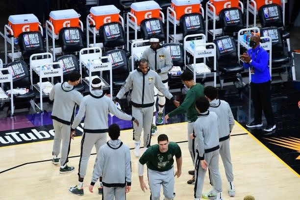 July 17: Khris Middleton of the Milwaukee Bucks walks on the court before Game Five of the 2021 NBA Finals on July 17, 2021 at Footprint Center in...