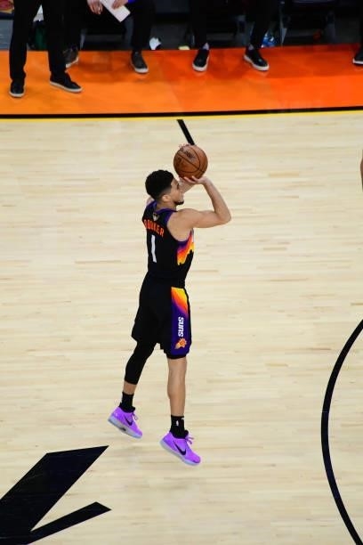July 17: Devin Booker of the Phoenix Suns shoots a three point basket against the Milwaukee Bucks during Game Five of the 2021 NBA Finals on July 17,...