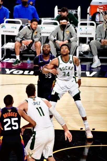 Jae Crowder of the Phoenix Suns and Giannis Antetokounmpo of the Milwaukee Bucks fights for rebound on July 17, 2021 during Game Five of the NBA...