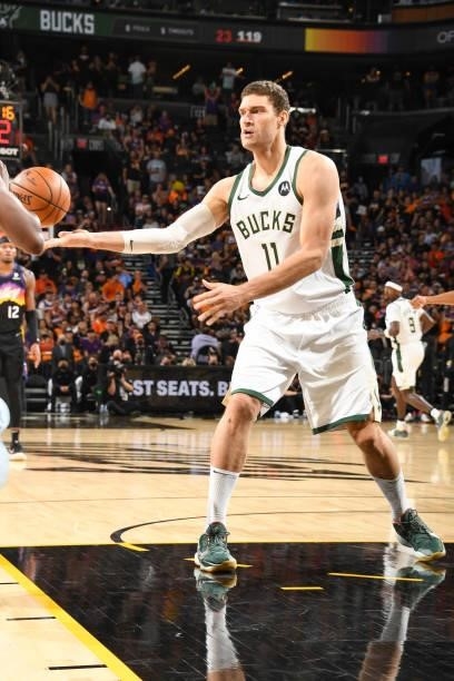 Brook Lopez of the Milwaukee Bucks passes the ball during the game against the Phoenix Suns during Game Five of the 2021 NBA Finals on July 17, 2021...