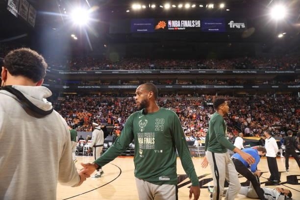 July 17: Khris Middleton of the Milwaukee Bucks high fives before the game against the Phoenix Suns during Game Five of the 2021 NBA Finals on July...