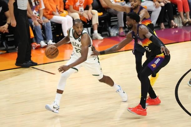 July 17: Deandre Ayton of the Phoenix Suns plays defense on Khris Middleton of the Milwaukee Bucks during Game Five of the 2021 NBA Finals on July...