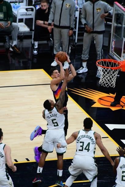 July 17: Devin Booker of the Phoenix Suns drives to the basket against the Milwaukee Bucks during Game Five of the 2021 NBA Finals on July 17, 2021...