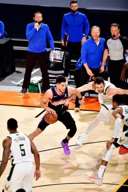 Devin Booker of the Phoenix Suns drives to the basket against the Milwaukee Bucks on July 17, 2021 during Game Five of the NBA Finals at Footprint...