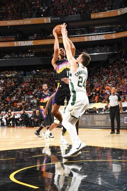 Cameron Payne of the Phoenix Suns drives to the basket as Pat Connaughton of the Milwaukee Bucks plays defense during Game Five of the 2021 NBA...