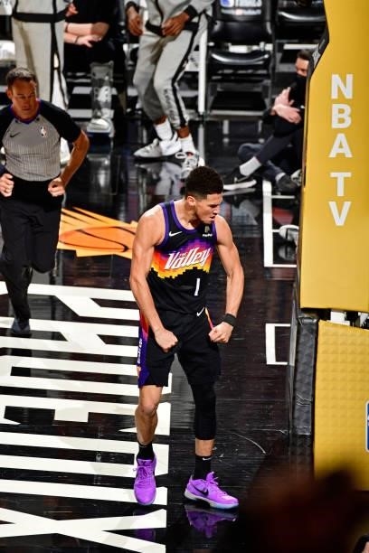 Devin Booker of the Phoenix Suns celebrates during the game against the Milwaukee Bucks on July 17, 2021 during Game Five of the NBA Finals at...