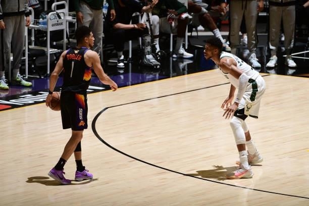 July 17: Giannis Antetokounmpo of the Milwaukee Bucks plays defense on Devin Booker of the Phoenix Suns during Game Five of the 2021 NBA Finals on...