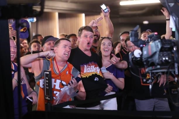 July 17: Phoenix Suns fans cheer for a camera before the Milwaukee Bucks game against the Phoenix Suns during Game Five of the 2021 NBA Finals on...