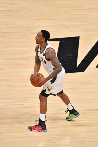 Jeff Teague of the Milwaukee Bucks passes the ball against the Phoenix Suns during Game Five of the 2021 NBA Finals on July 17, 2021 at Footprint...