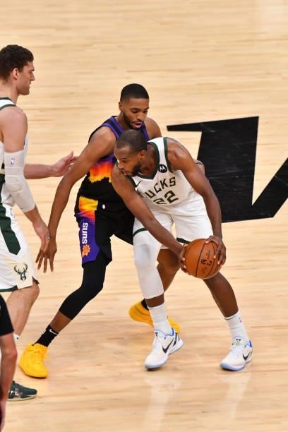 Khris Middleton of the Milwaukee Bucks handles the ball against Mikal Bridges of the Phoenix Suns during Game Five of the 2021 NBA Finals on July 17,...