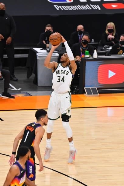 Giannis Antetokounmpo of the Milwaukee Bucks shoots a three-pointer against the Phoenix Suns during Game Five of the 2021 NBA Finals on July 17, 2021...
