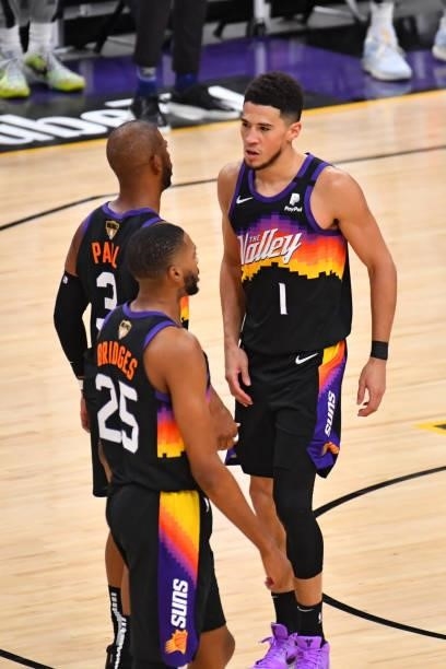 Chris Paul of the Phoenix Suns and Devin Booker of the Phoenix Suns talk during Game Five of the 2021 NBA Finals on July 17, 2021 at Footprint Center...