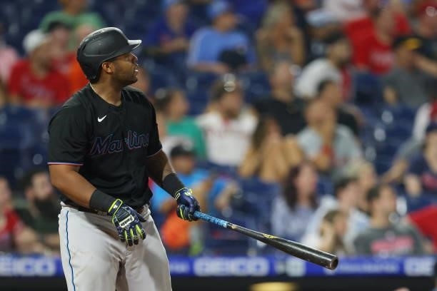Jesus Aguilar of the Miami Marlins watches as he hits a two-run home run against the Philadelphia Phillies during the ninth inning of a game at...