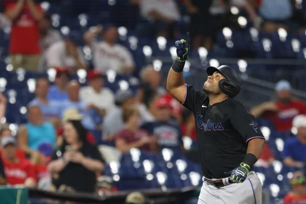 Jesus Aguilar of the Miami Marlins gestures after he hit a two-run home run against the Philadelphia Phillies during the ninth inning of a game at...