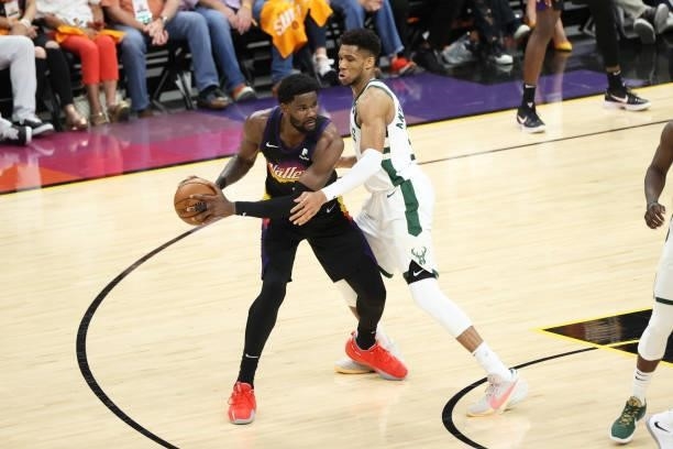 July 17: Giannis Antetokounmpo of the Milwaukee Bucks plays defense on Deandre Ayton of the Phoenix Suns during Game Five of the 2021 NBA Finals on...