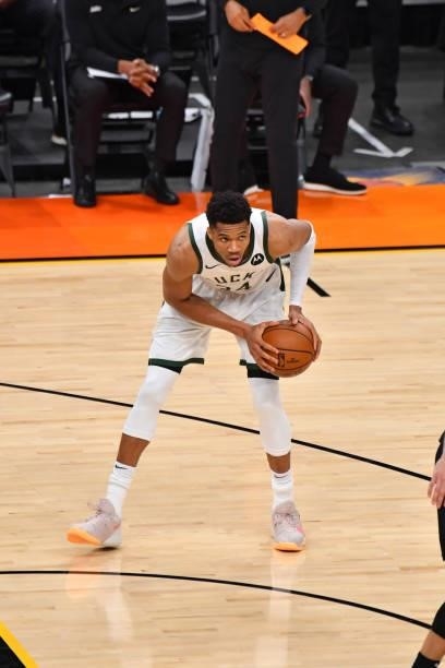 Giannis Antetokounmpo of the Milwaukee Bucks handles the ball against the Phoenix Suns during Game Five of the 2021 NBA Finals on July 17, 2021 at...