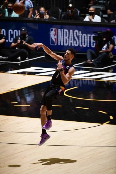 July 17: Devin Booker of the Phoenix Suns passes the ball against the Milwaukee Bucks during Game Five of the 2021 NBA Finals on July 17, 2021 at...