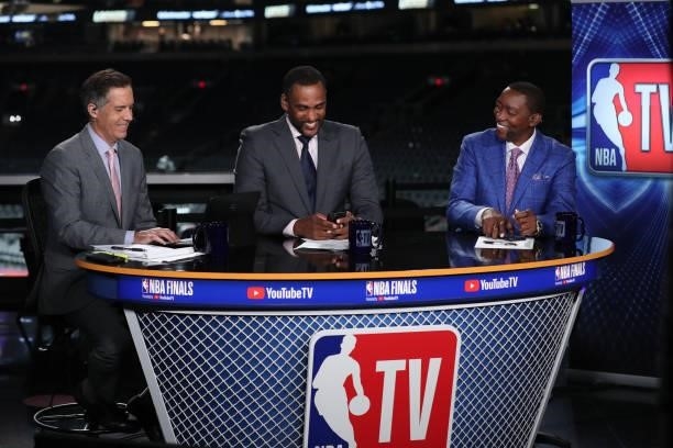 July 17: NBA TV Analysts Matt Winer, Steve Smith and Isiah Thomas smile after the Milwaukee Bucks game against the Phoenix Suns during Game Five of...
