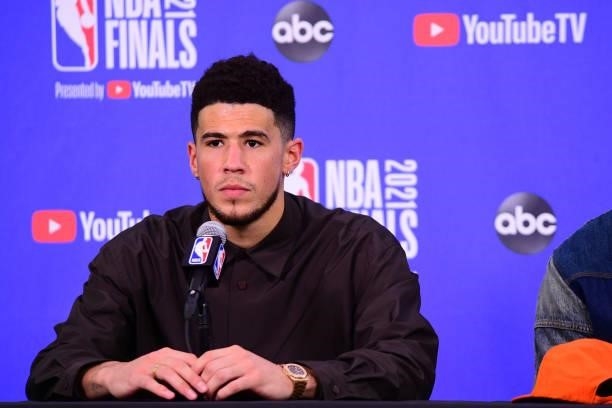 July 17: Devin Booker of the Phoenix Suns talks to the media after Game Five of the 2021 NBA Finals on July 17, 2021 at Footprint Center in Phoenix,...