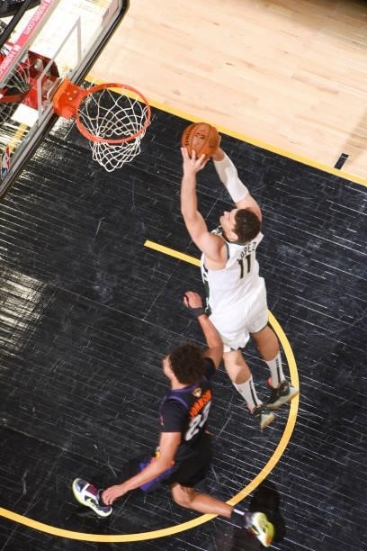 Brook Lopez of the Milwaukee Bucks dunks the ball during the game against the Phoenix Suns during Game Five of the 2021 NBA Finals on July 17, 2021...