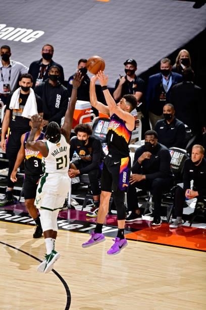 Devin Booker of the Phoenix Suns shoots the ball against the Milwaukee Bucks on July 17, 2021 during Game Five of the NBA Finals at Footprint Center...