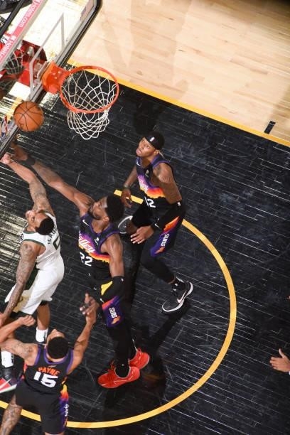 Jeff Teague of the Milwaukee Bucks and Deandre Ayton of the Phoenix Suns fight for the rebound during Game Five of the 2021 NBA Finals on July 17,...