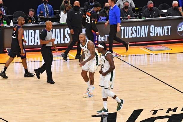Tucker of the Milwaukee Bucks and Jrue Holiday of the Milwaukee Bucks react during Game Five of the 2021 NBA Finals on July 17, 2021 at Footprint...
