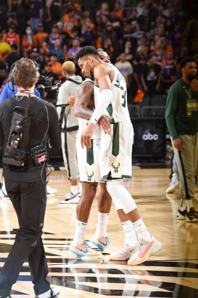 Tucker of the Milwaukee Bucks hugs Giannis Antetokounmpo of the Milwaukee Bucks after the game against the Phoenix Suns during Game Five of the 2021...