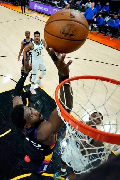 Phoenix Suns center Deandre Ayton, left, scores as Milwaukee Bucks guard Jeff Teague looks on during the first half of Game Five of the 2021 NBA...