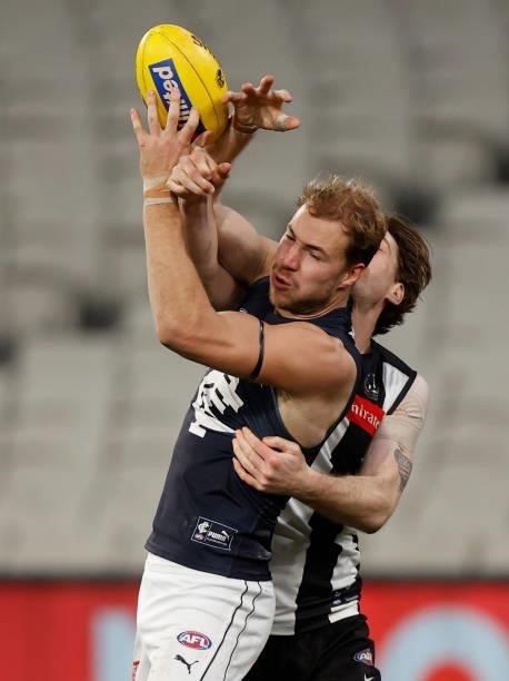Harry McKay of the Blues marks the ball ahead of Jordan Roughead of the Magpies during the 2021 AFL Round 18 match between the Collingwood Magpies...