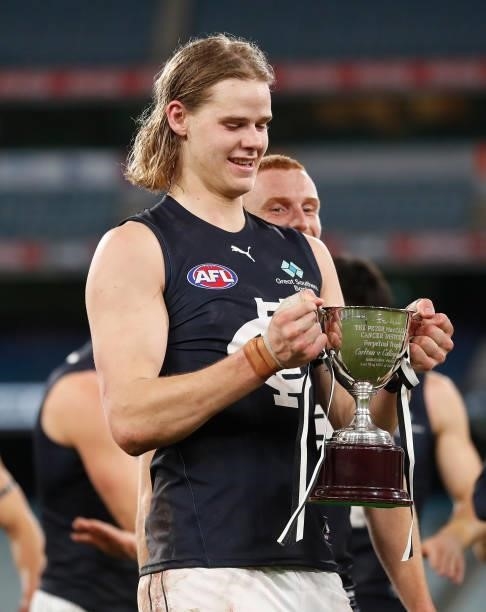 Tom De Koning of the Blues holds the Peter Mac Cup during the 2021 AFL Round 18 match between the Collingwood Magpies and the Carlton Blues at the...