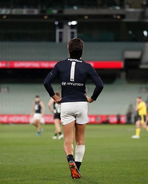 Jack Silvagni of the Blues looks to the heavens in memory of his grandfather Sergio during the 2021 AFL Round 18 match between the Collingwood...