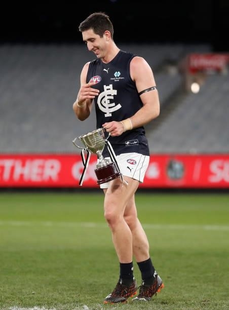 Jacob Weitering of the Blues holds the Peter Mac Cup during the 2021 AFL Round 18 match between the Collingwood Magpies and the Carlton Blues at the...