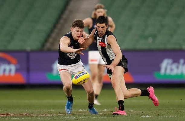 Scott Pendlebury of the Magpies and Sam Walsh of the Blues compete for the ballduring the 2021 AFL Round 18 match between the Collingwood Magpies and...