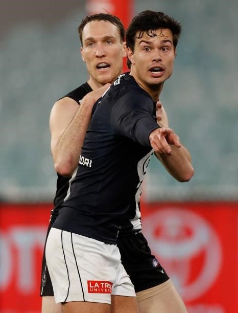 Jack Silvagni of the Blues and Jack Madgen of the Magpies in action during the 2021 AFL Round 18 match between the Collingwood Magpies and the...