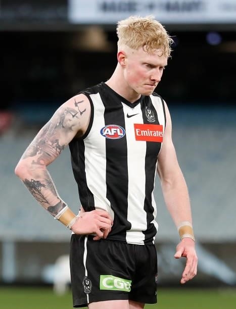 John Noble of the Magpies looks dejected after a loss during the 2021 AFL Round 18 match between the Collingwood Magpies and the Carlton Blues at the...
