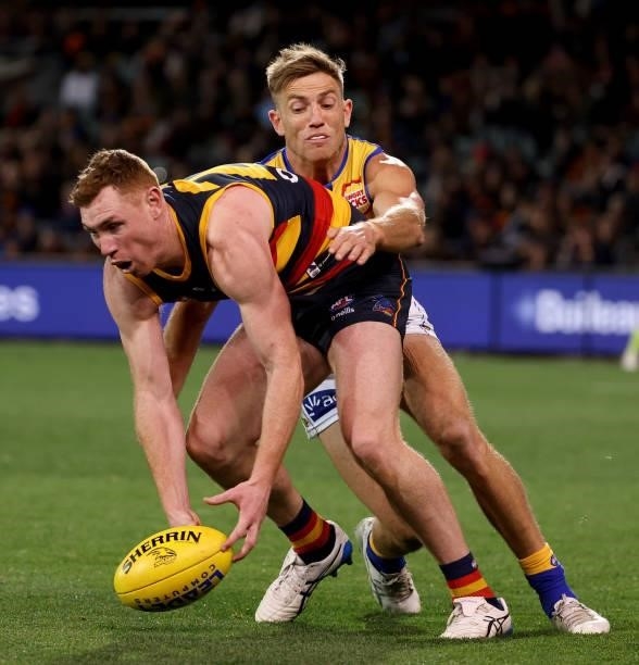 Tom Lynch of the Crows is tackled by Brad Sheppard of the Eagles during the 2021 AFL Round 18 match between the Adelaide Crows and the West Coast...