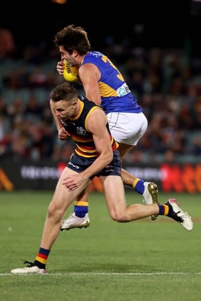 Brodie Smith of the Crows clashes with Andrew Gaff of the Eagles during the 2021 AFL Round 18 match between the Adelaide Crows and the West Coast...