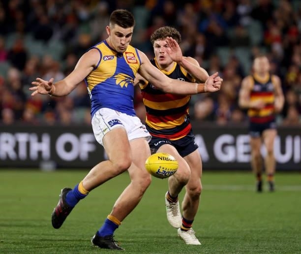 Elliot Yeo of the Eagles is tackled by Harry Schoenberg of the Crows during the 2021 AFL Round 18 match between the Adelaide Crows and the West Coast...