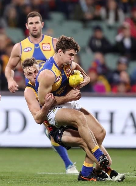 Jamie Cripps of the Eagles is tackled by Brodie Smith of the Crows during the 2021 AFL Round 18 match between the Adelaide Crows and the West Coast...